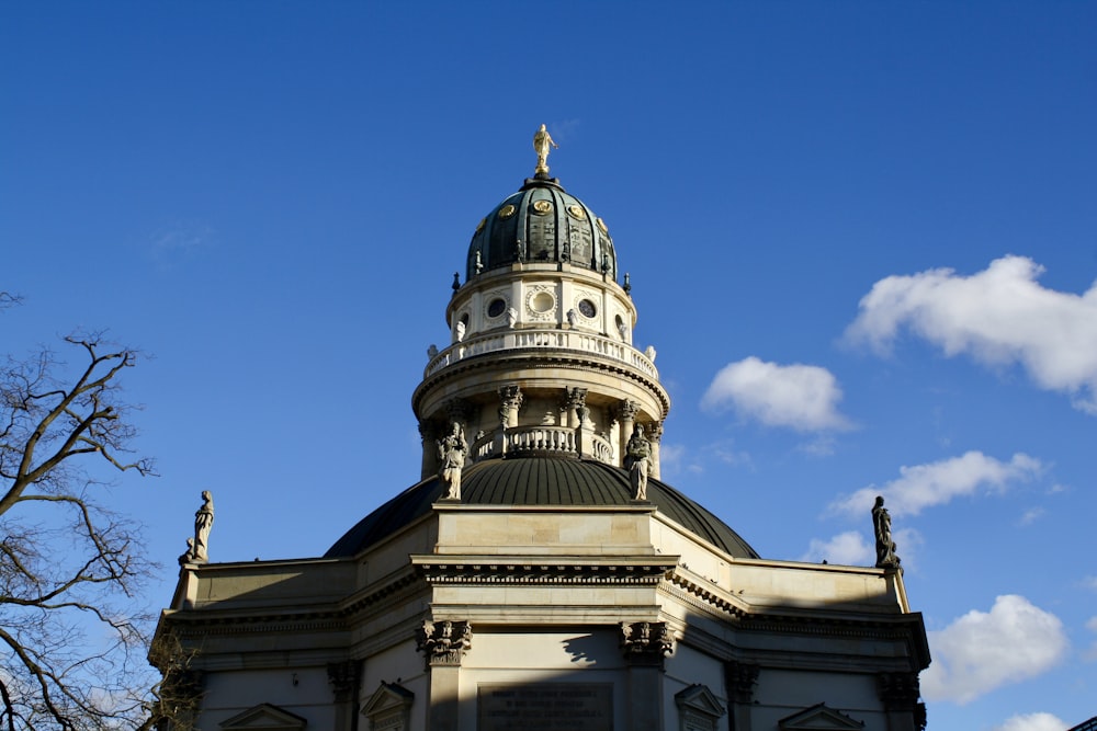 a tall building with a clock on the top of it