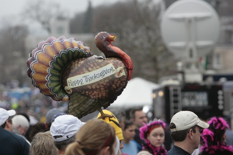 A joyful family receiving a free turkey at the Thanksgiving giveaway event.
