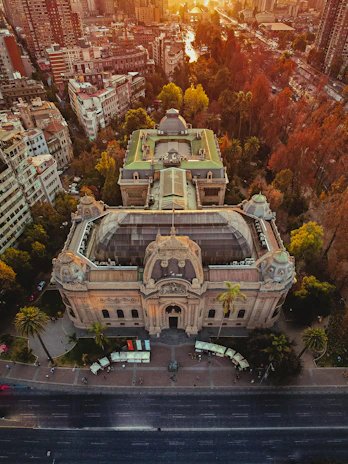 A stunning aerial view showcasing the elegant architecture and lush landscaping of New Heritage Development at golden hour.