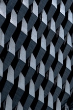 a black and white photo of a wall made of blocks