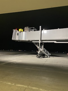 A newly completed passenger boarding bridge connecting a plane to the terminal.