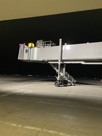A newly completed passenger boarding bridge connecting a plane to the terminal.