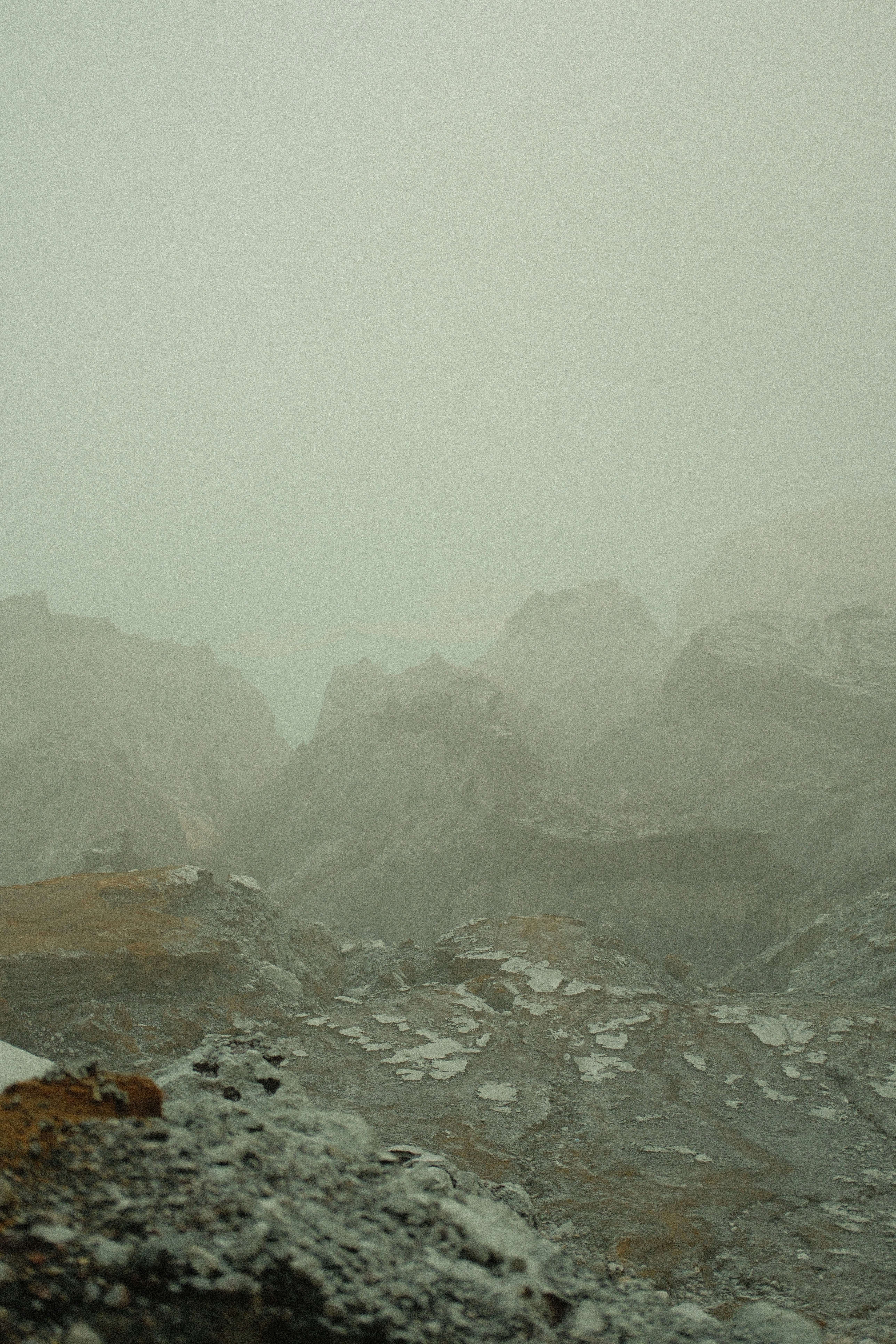 woman wearing yellow long-sleeved dress under white clouds and blue sky during daytime