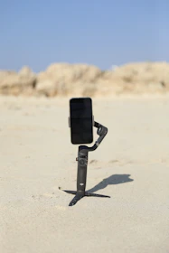 A professional making a clear HD call on a smartphone at a sunny beach.