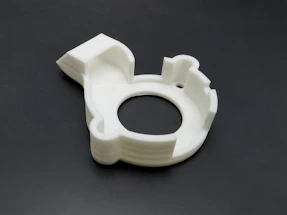 High-precision mechanical component printed in nylon, highlighting surface texture and durability.