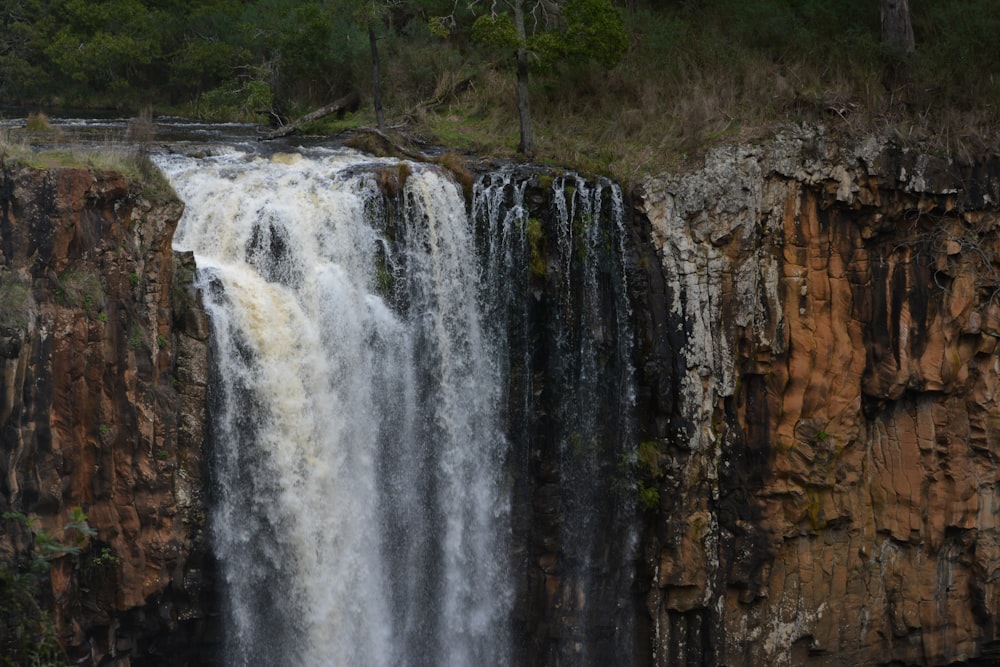 a large waterfall with lots of water coming out of it