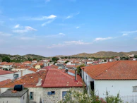 A panoramic view of a village with multiple roofs recently serviced by Hermans Braddy, highlighting uniform quality.