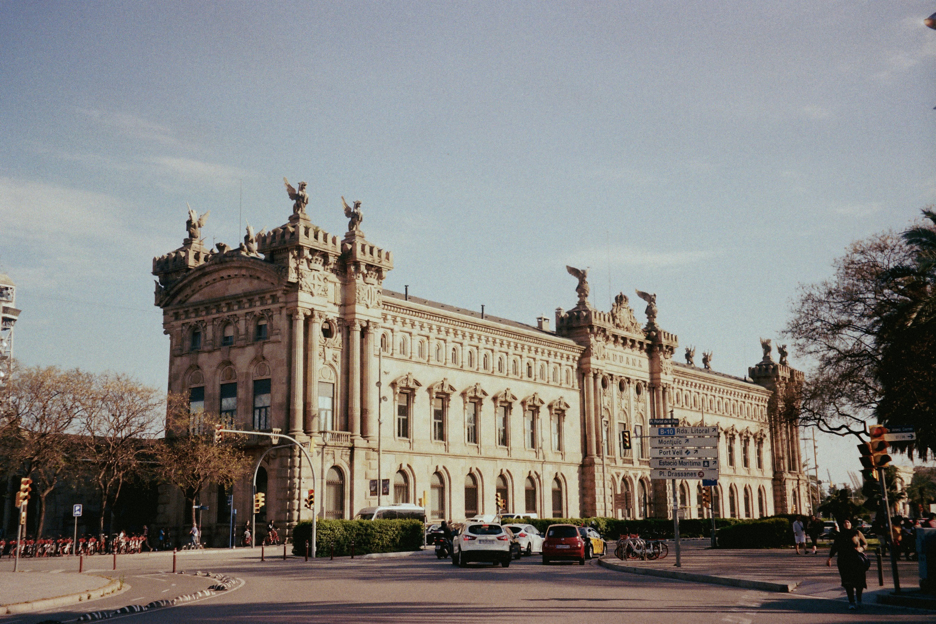 a large building with statues on top of it