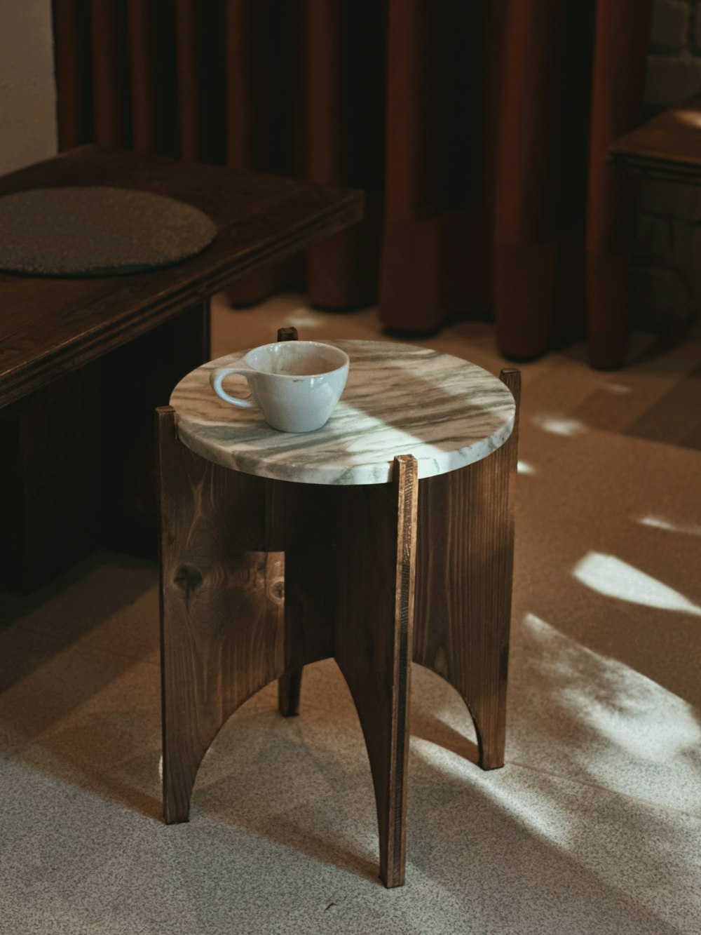 a wooden table with a bowl on top of it