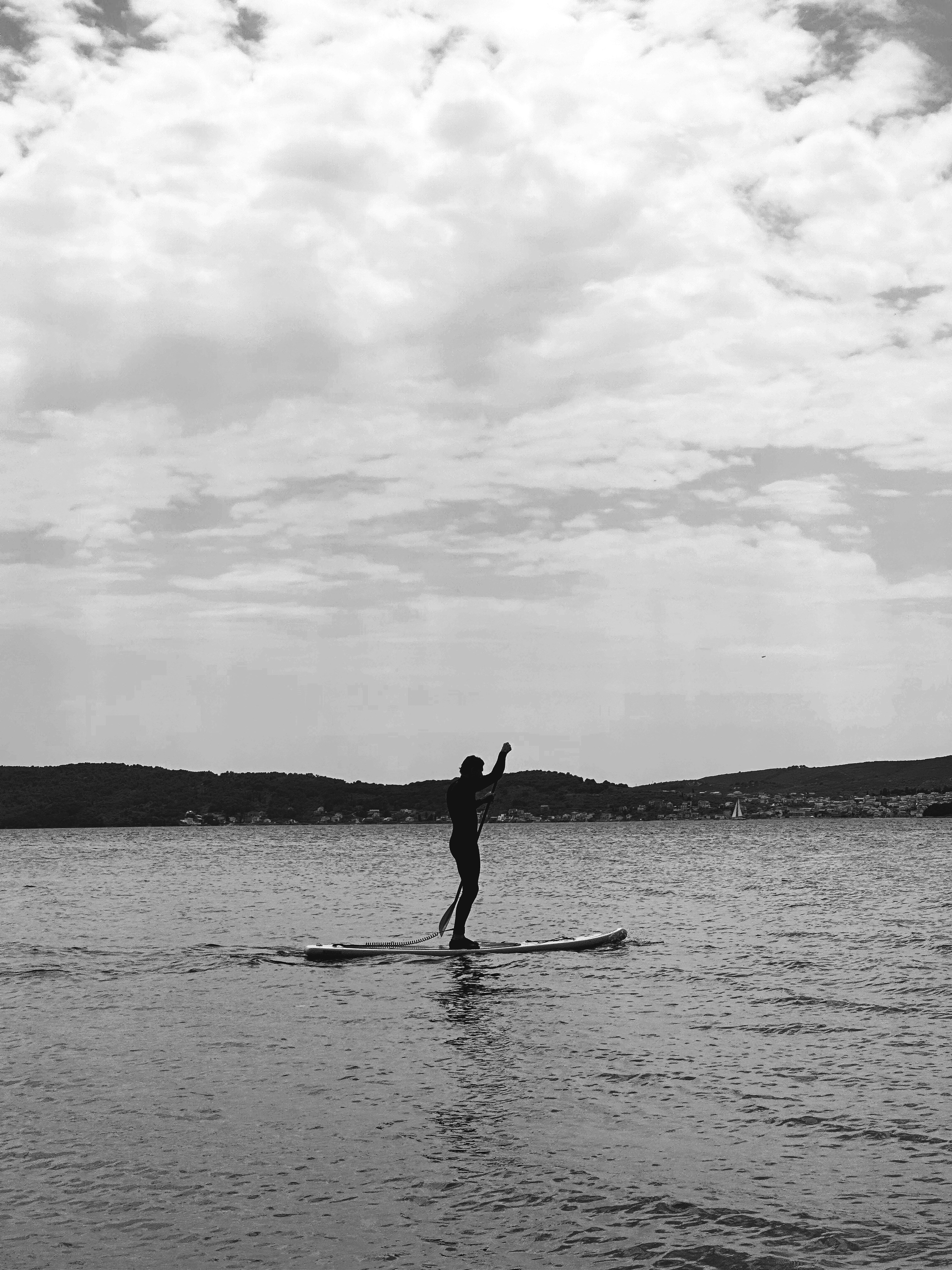 a person riding a surf board on a body of water