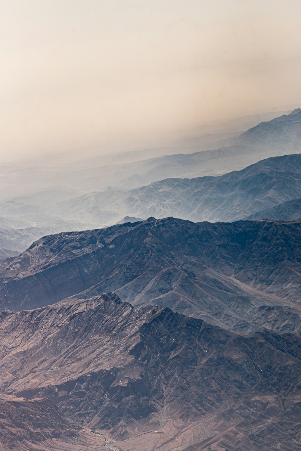 a view of a mountain range from an airplane