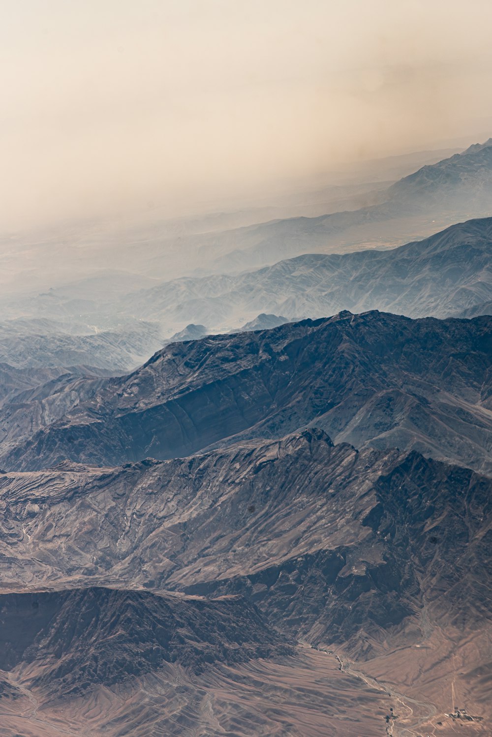 a view of a mountain range from an airplane