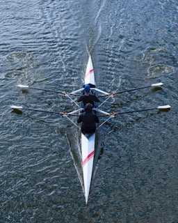 a person rowing a boat on a body of water