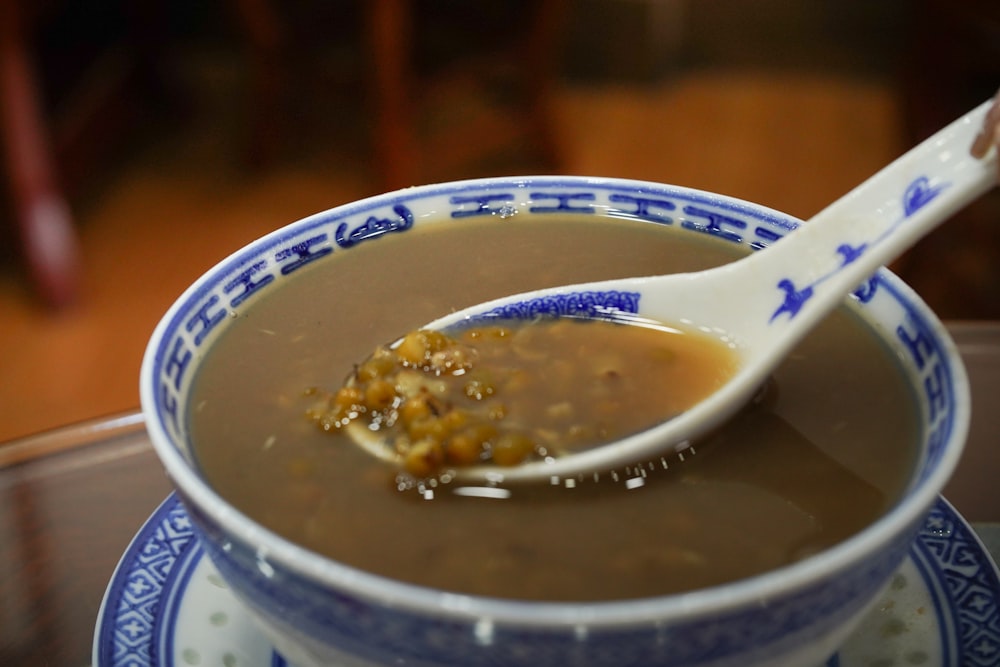 a bowl of soup with a spoon in it