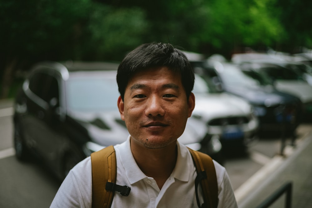 a man standing in front of a parking lot