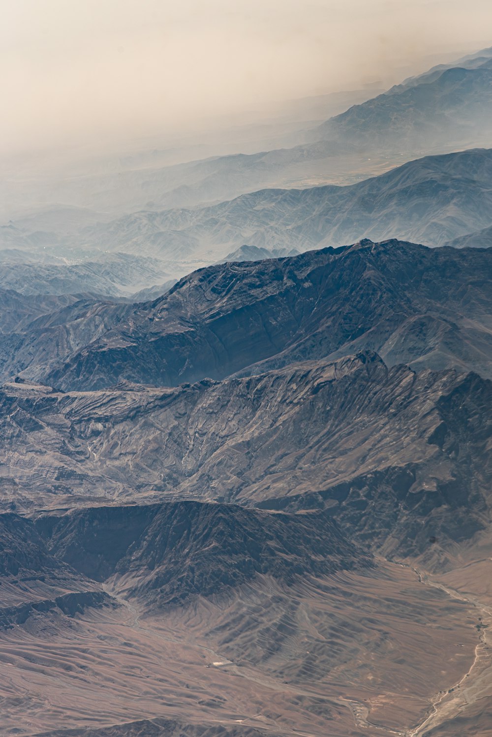 a view of a mountain range from an airplane