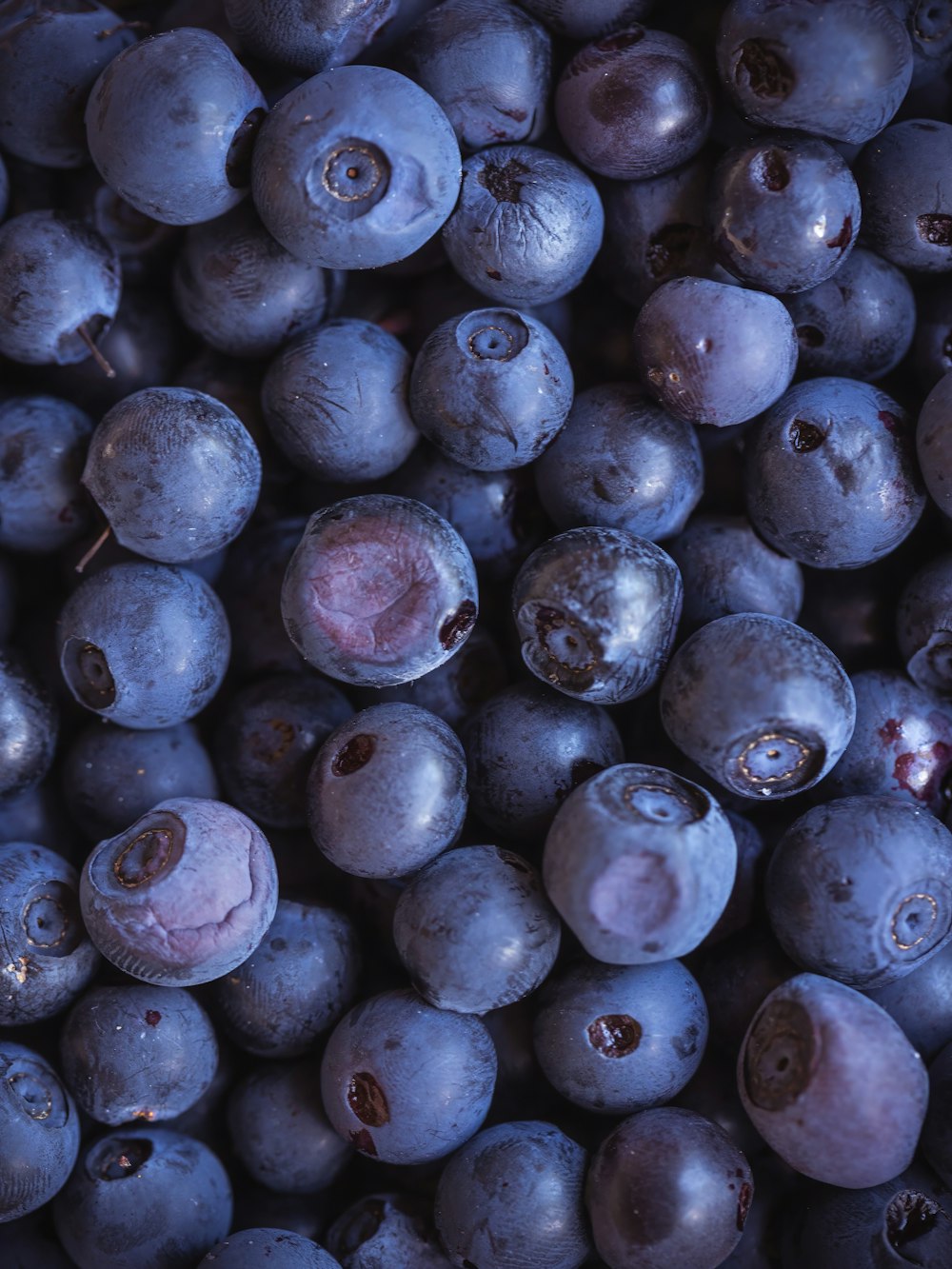 a bunch of blueberries that are sitting on a table