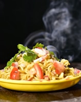 a yellow bowl filled with food on top of a wooden table