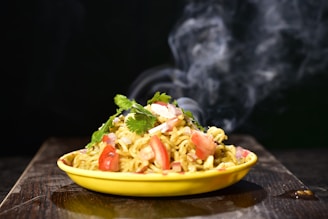 a yellow bowl filled with food on top of a wooden table