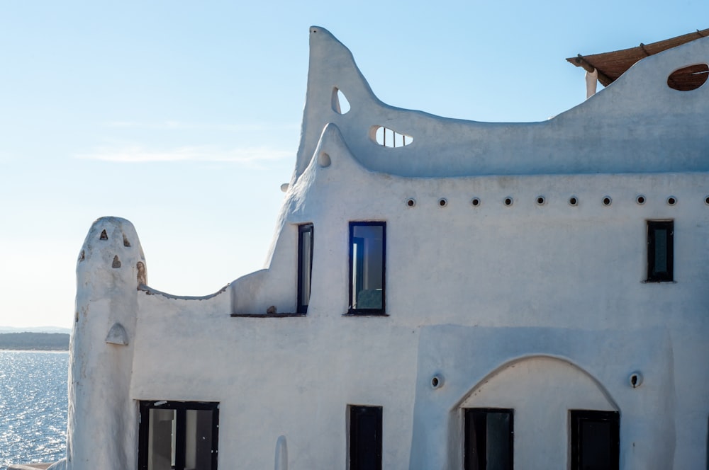 a white building with a blue sky in the background