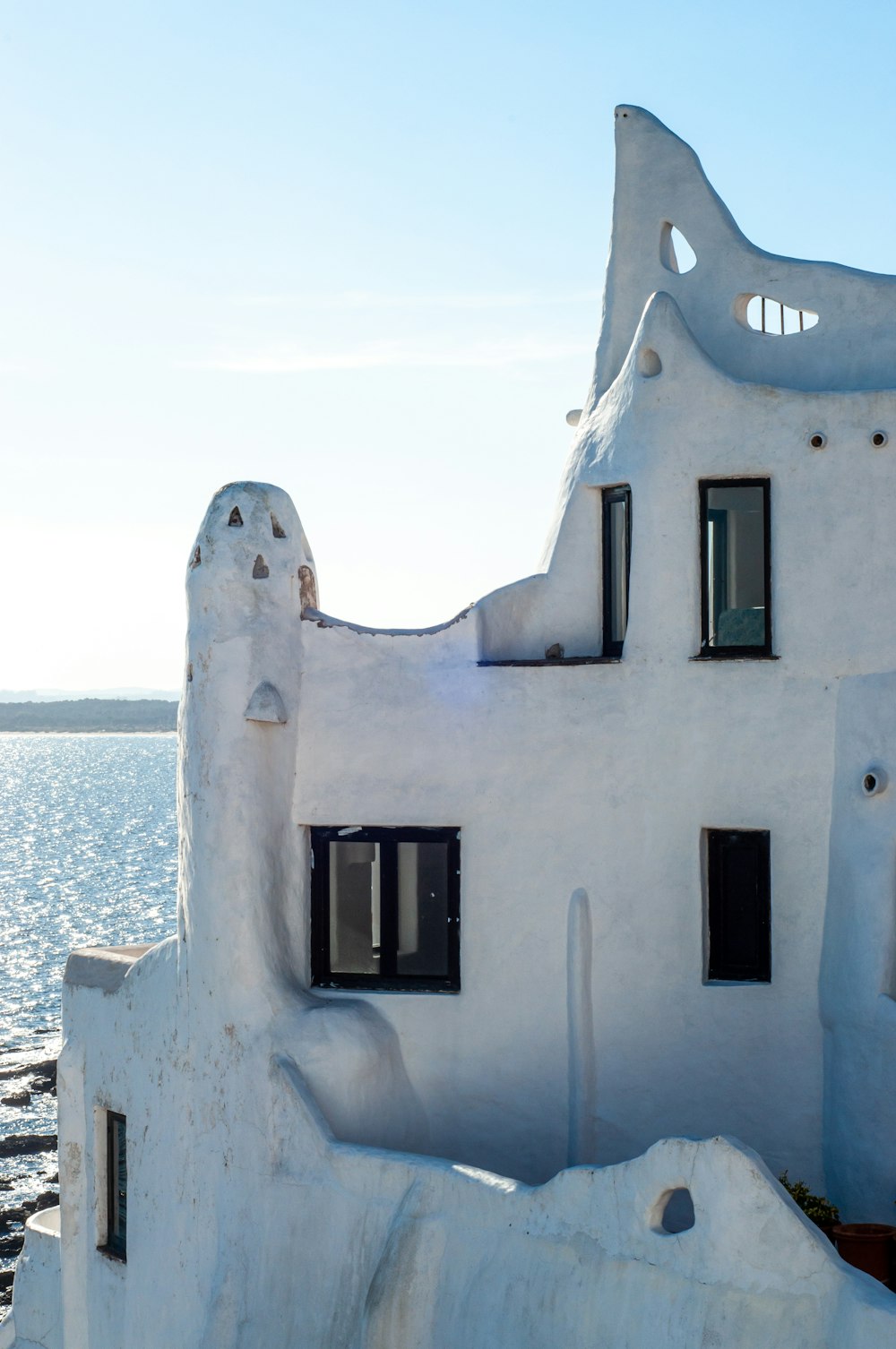 a white building with windows on the side of it