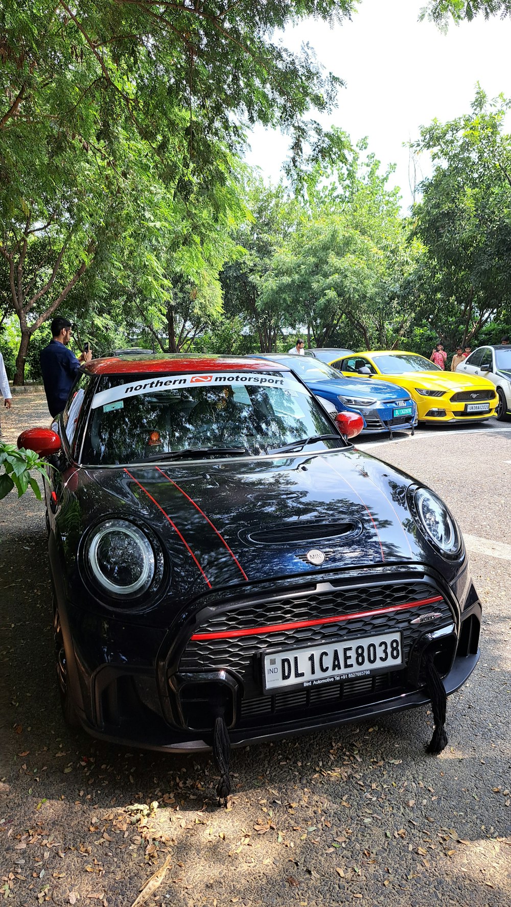 a black sports car parked on the side of the road