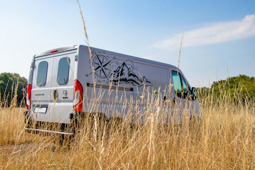 A white van with GPS tracking device shown on a digital map interface.