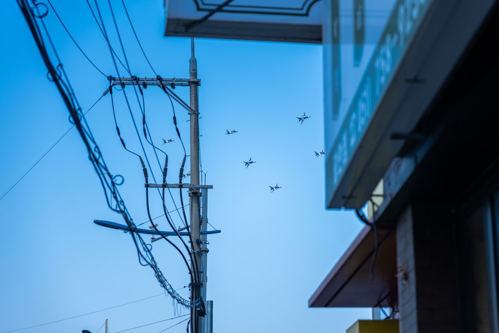 a group of airplanes flying over a building