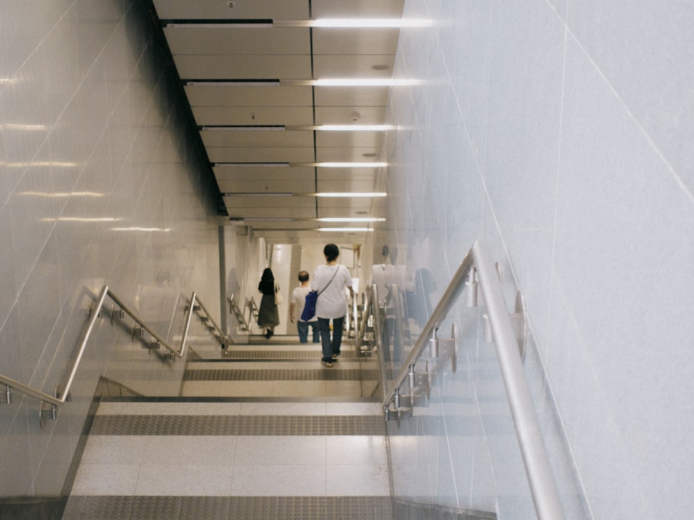 a group of people walking down a flight of stairs