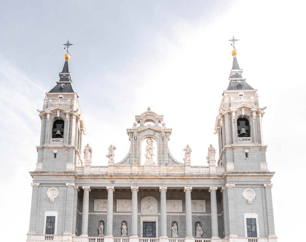 a large white building with two towers on top of it