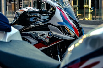 Front view of a sleek, modern motorcycle parked on a city street.