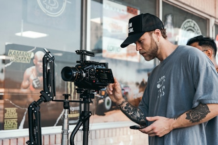 a man holding a camera in front of a camera