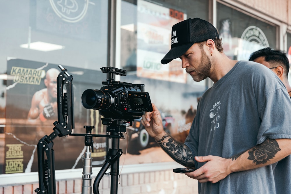 a man holding a camera in front of a camera