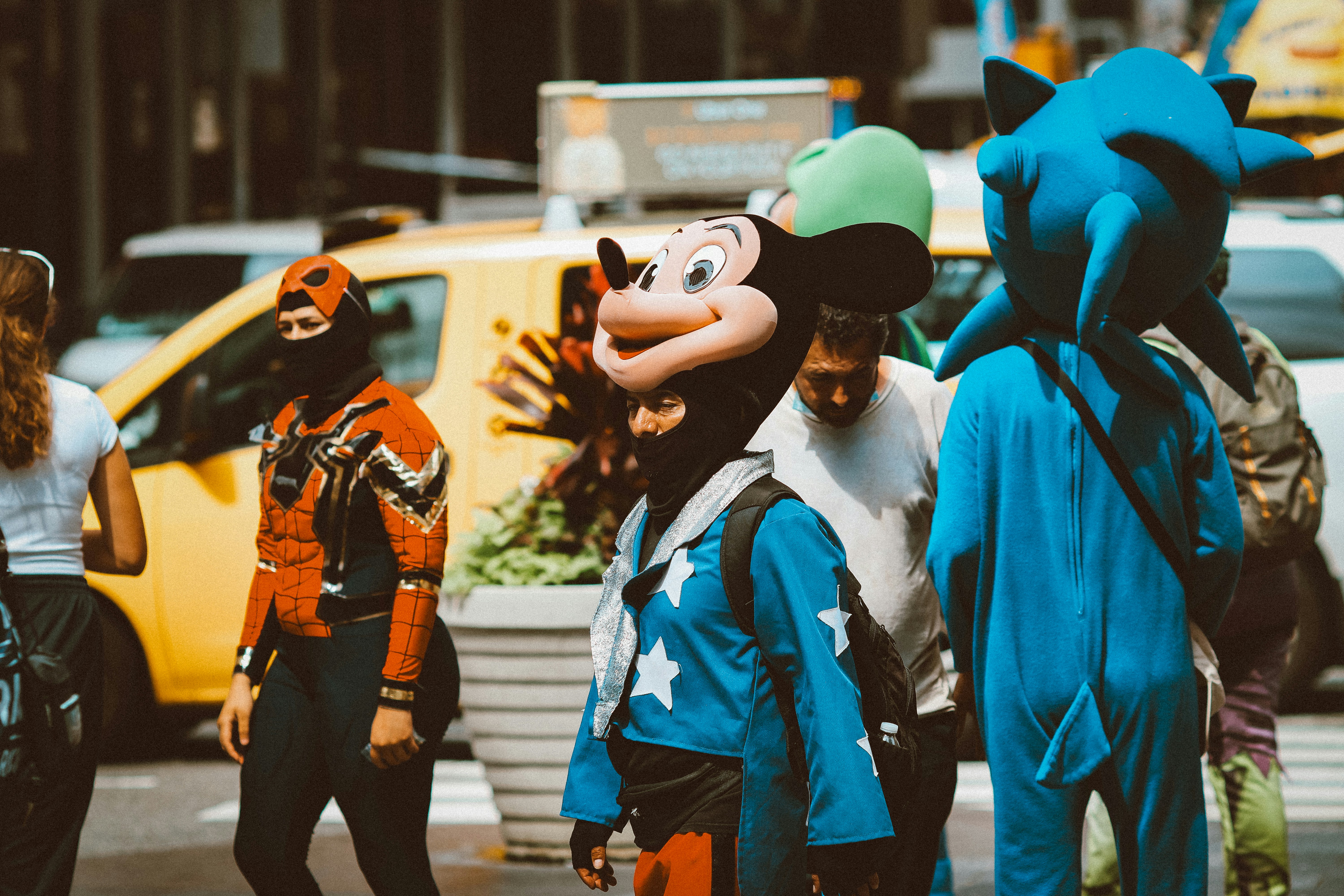a group of people in mickey mouse costumes