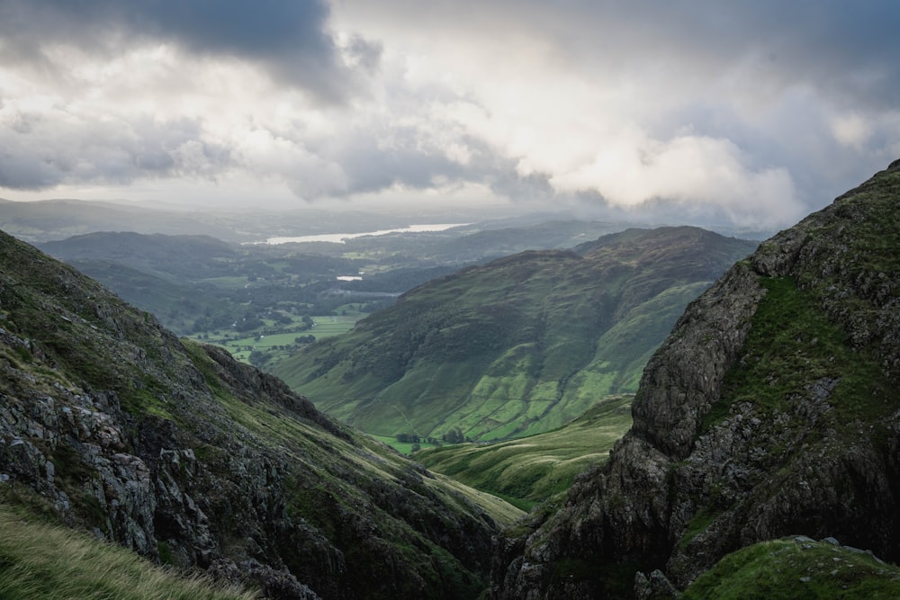 a view of a valley with mountains in the background