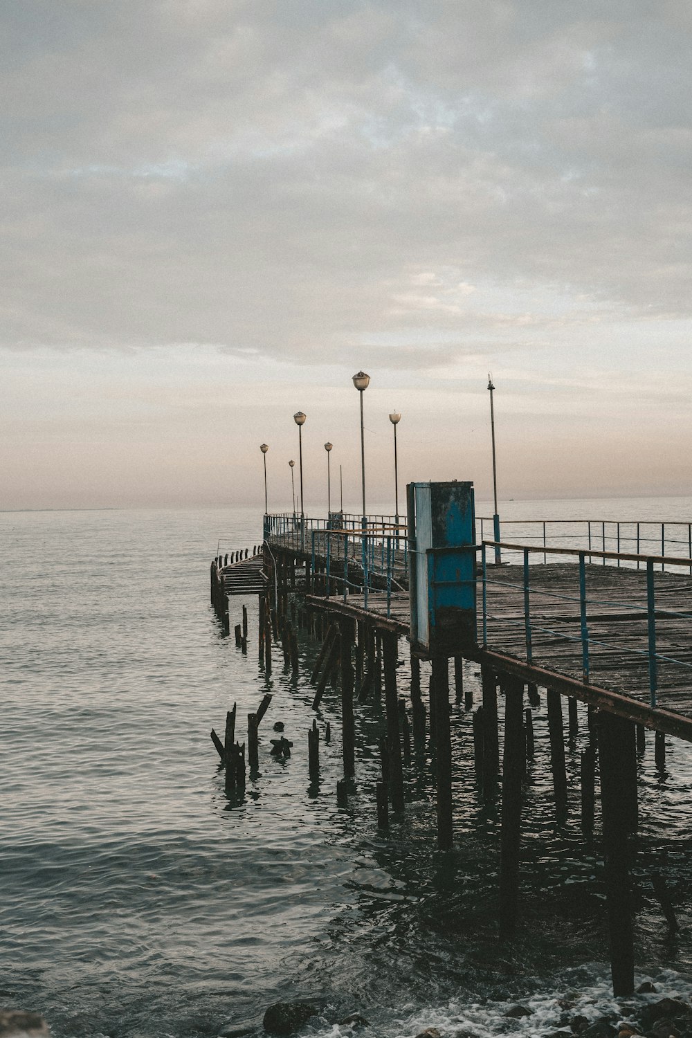 a pier that has some lights on it