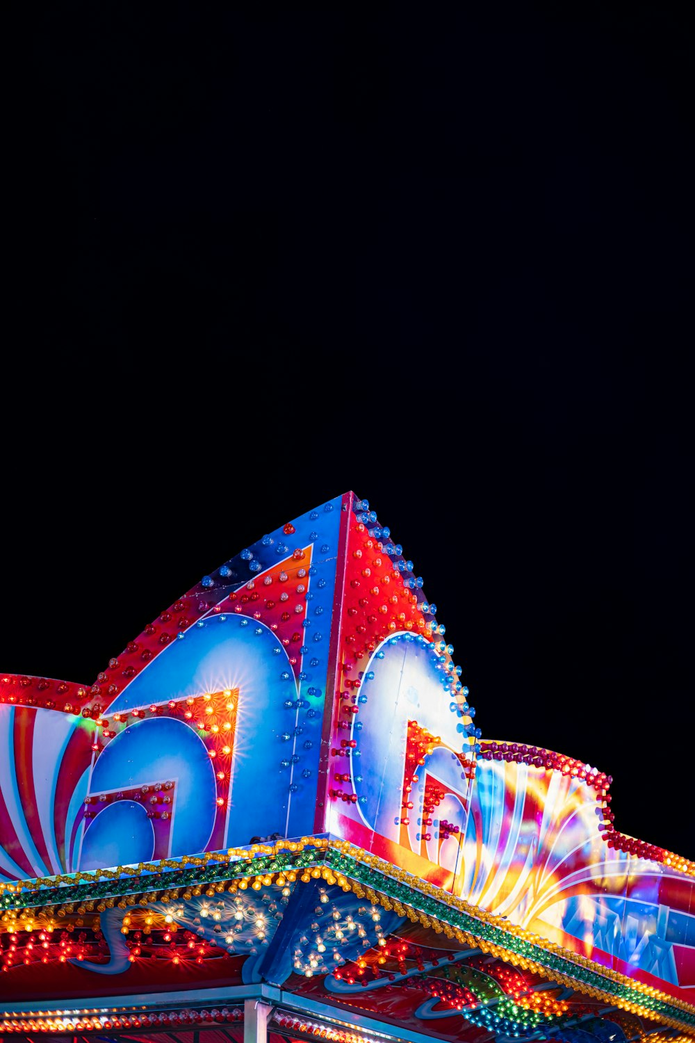 a merry go round ride lit up at night