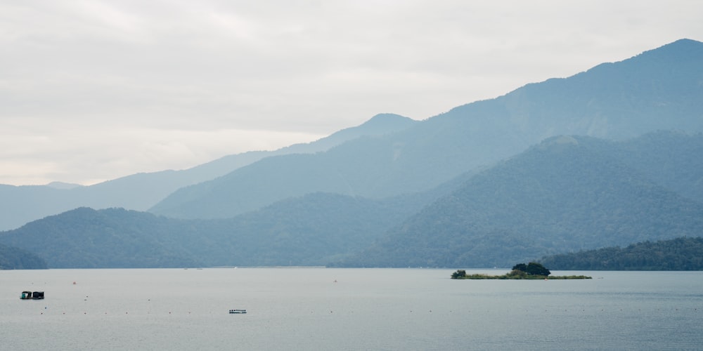 a body of water with a small island in the middle of it