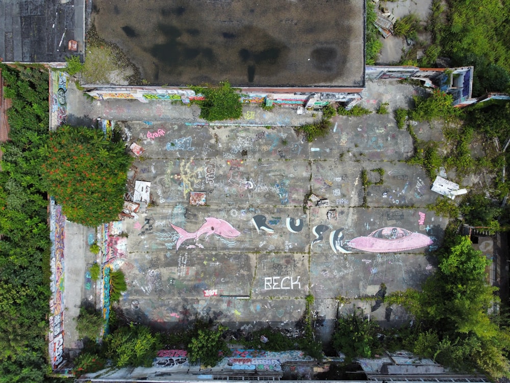 an aerial view of a parking lot covered in graffiti