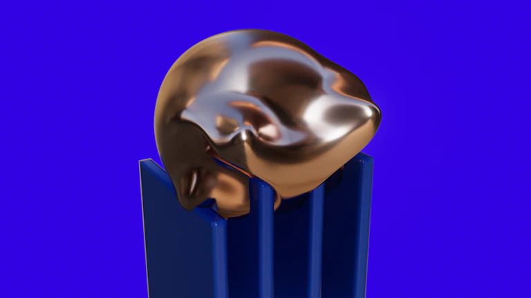 A close-up of a polished skeptron resting on a dark blue velvet cloth with gold trim.