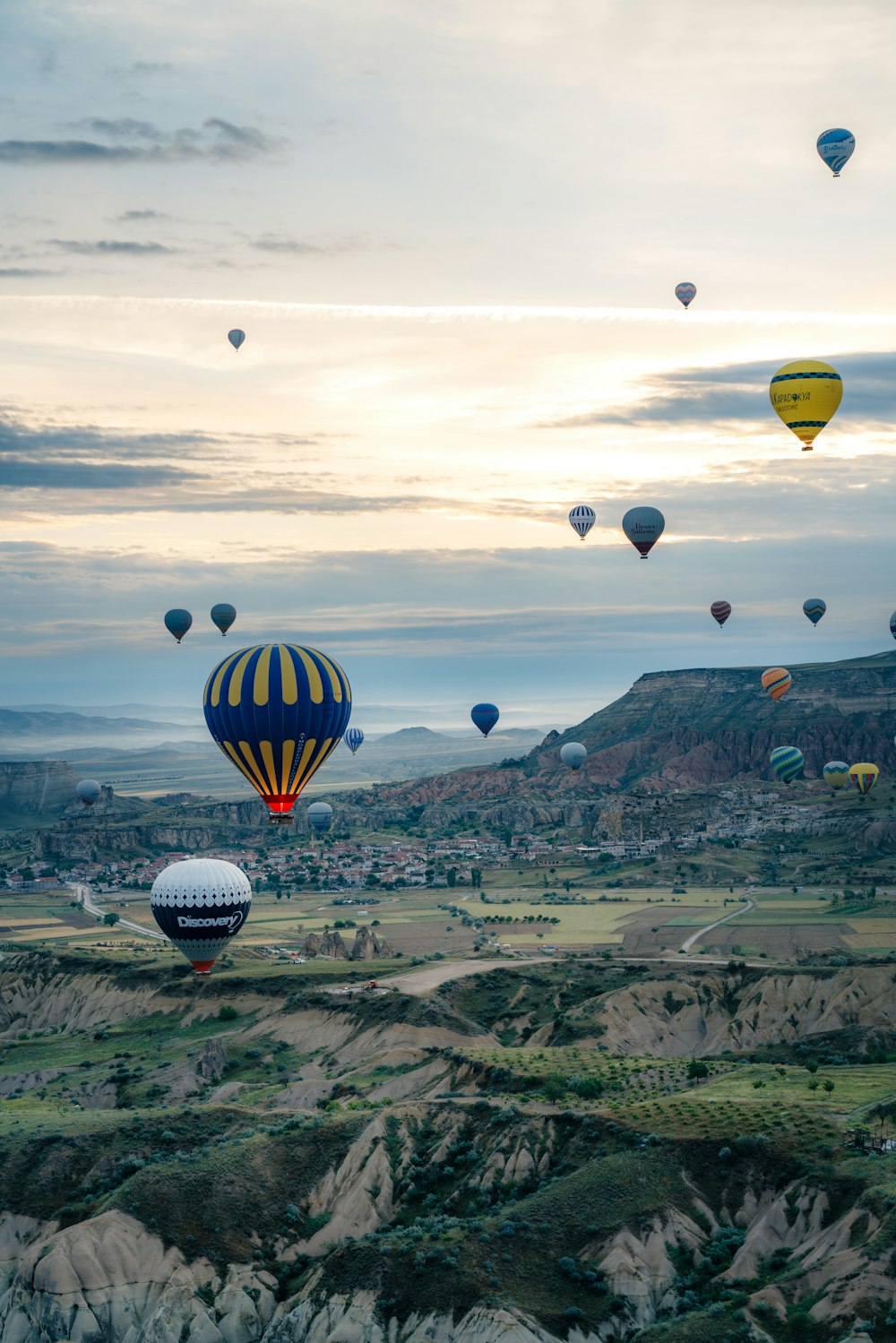 a bunch of hot air balloons flying in the sky