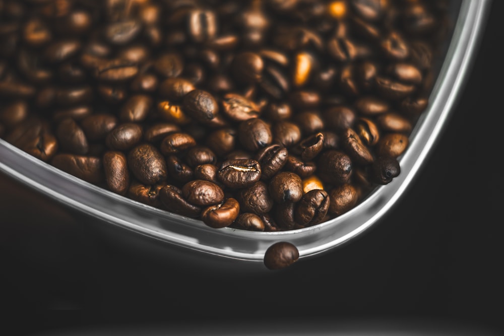 a close up of coffee beans in a container