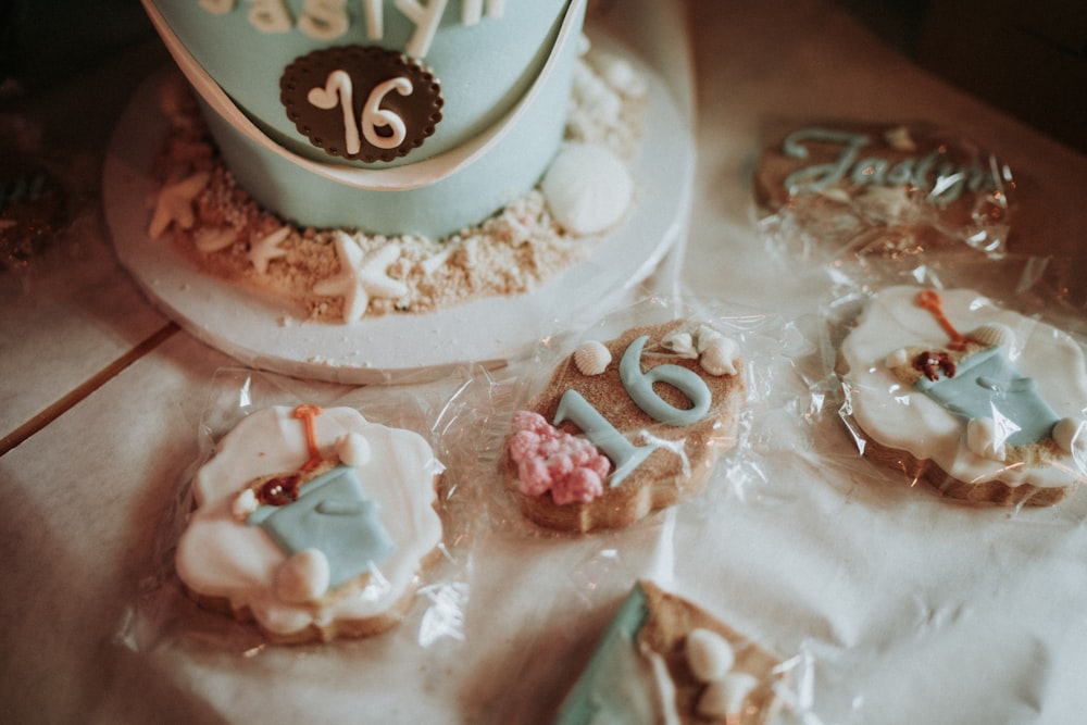 a birthday cake and cookies on a table