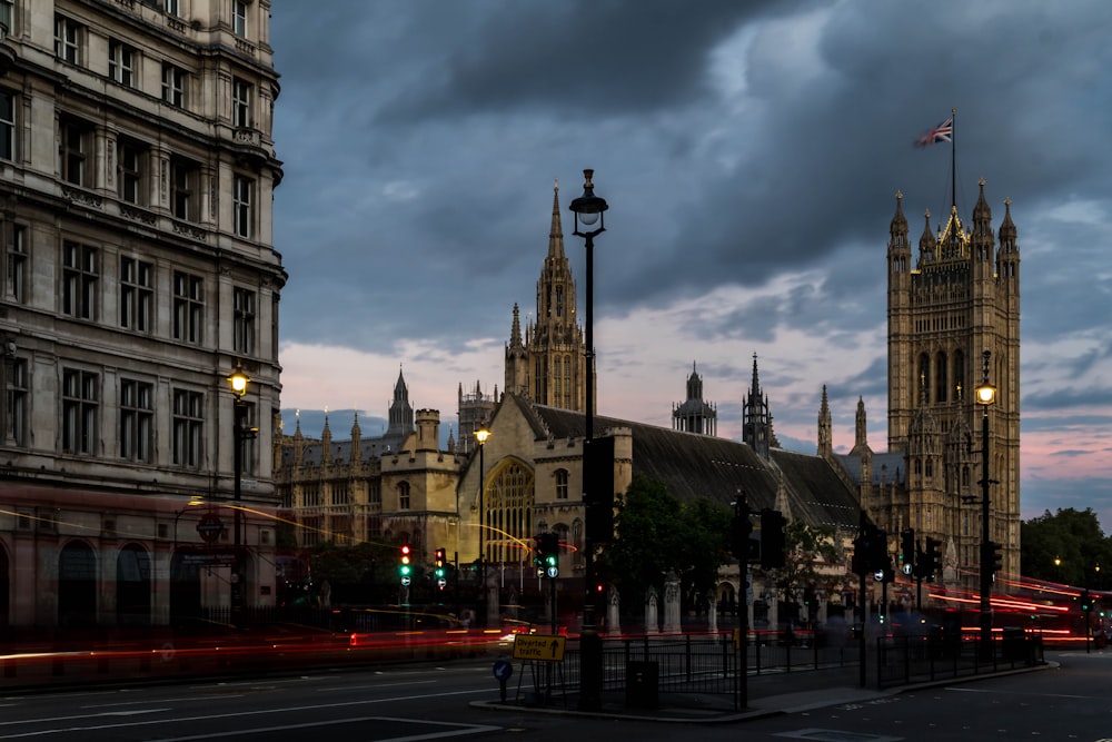 a city street with a clock tower in the background