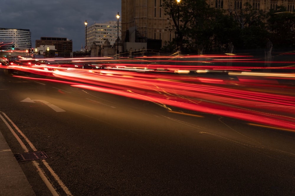 a city street filled with lots of traffic at night