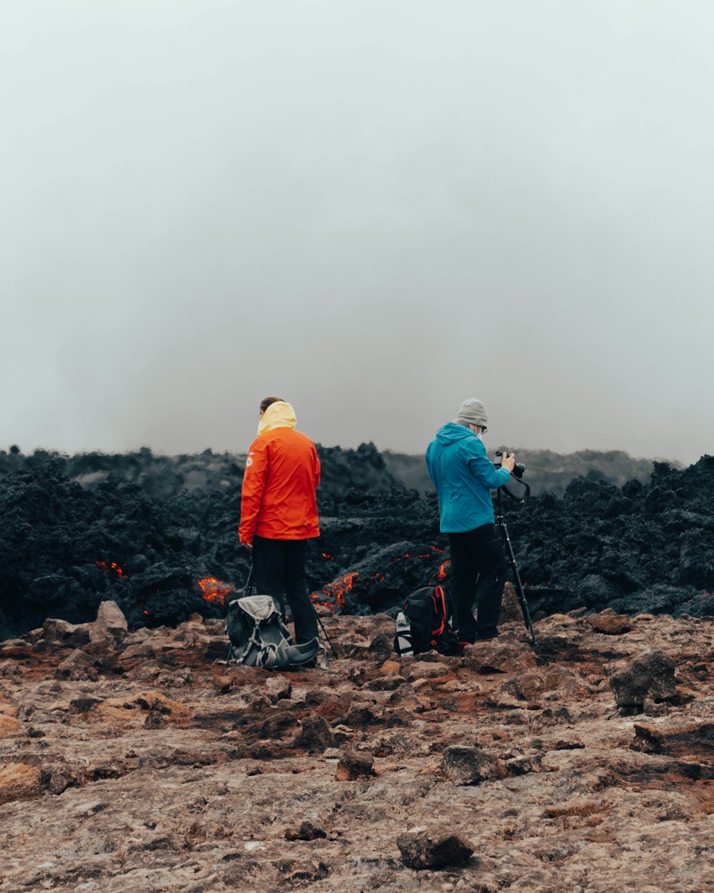 a couple of people that are standing in the dirt