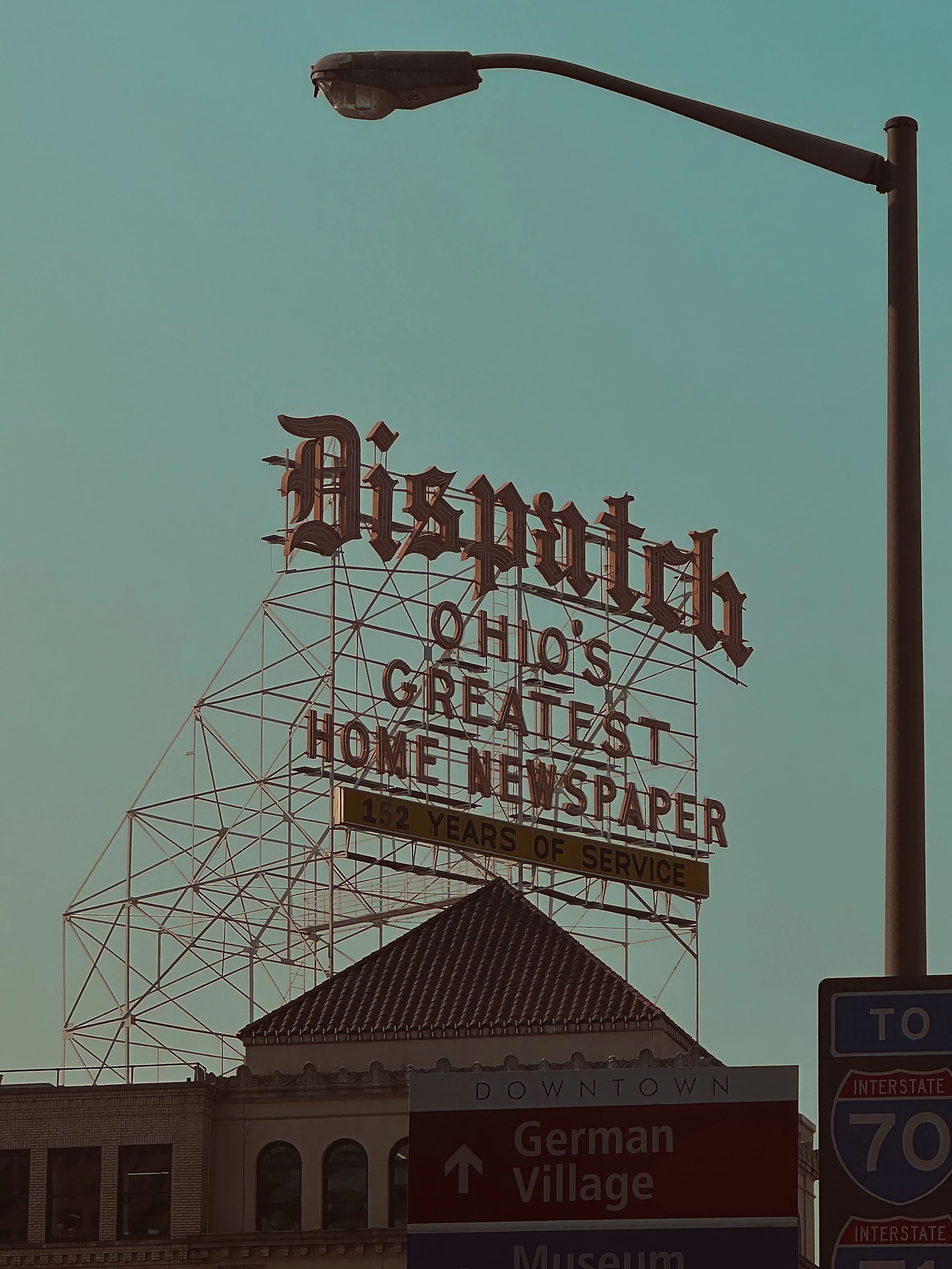 woman wearing yellow long-sleeved dress under white clouds and blue sky during daytime