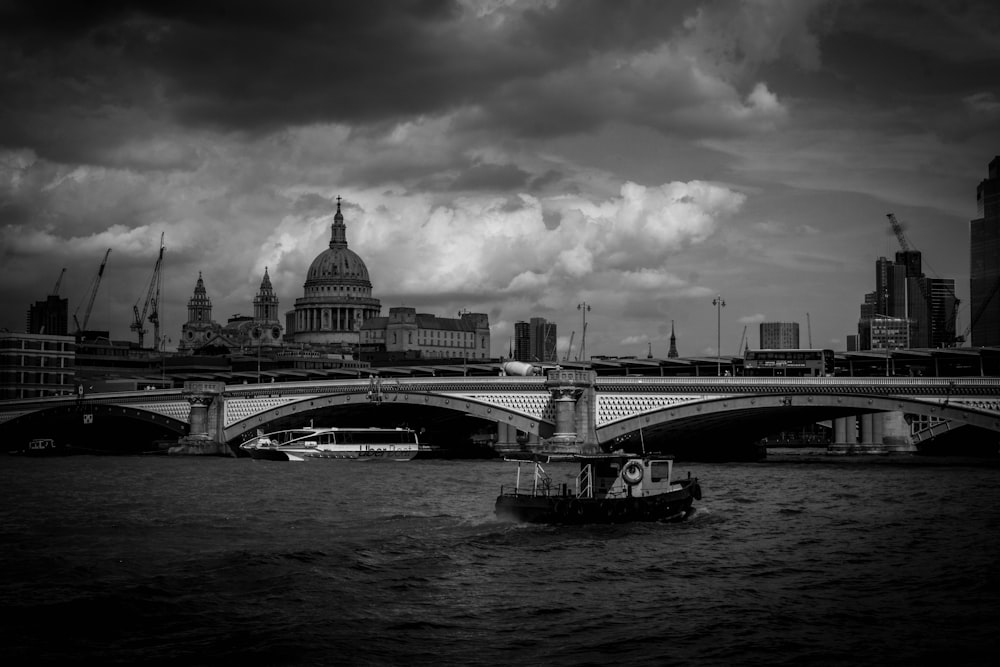 a black and white photo of a boat in the water