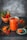 A glass jar filled with red chili sauce is placed on a dark slate surface, accompanied by a small bowl containing whole red chilies. A spoon rests on the jar's lid, with a portion of the sauce on it. Chili powder is sprinkled on the surface, adding texture and color.