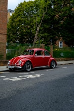 a red car parked on the side of the road